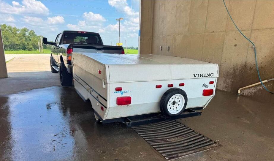 Cleaned Viking pop-up camper attached to a pickup